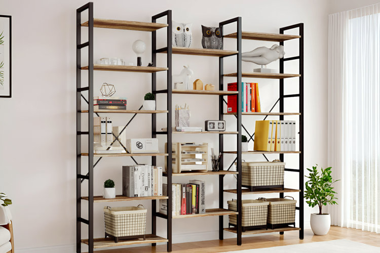 modern etagere shelving units with black metal frames and wooden shelves styled with books, baskets, and decorative objects