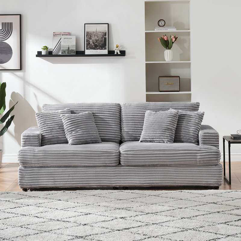 Spacious and Comfortable 3 - Seater Sofa with Four Throw Pillows, Ideal for Relaxing and Entertaining in a Modern Living Room