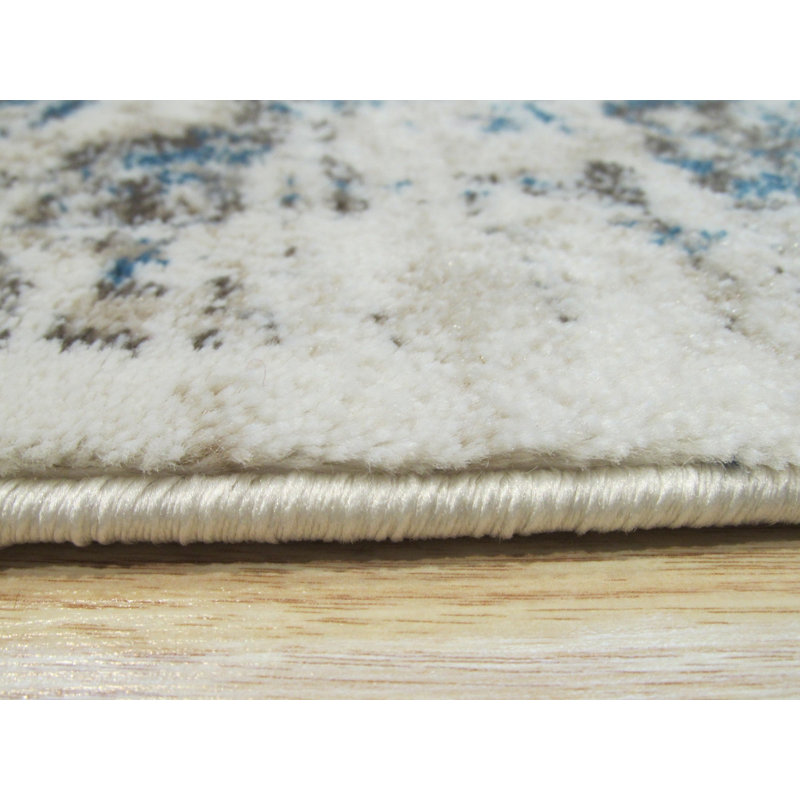 Tapis de style oriental traditionnel en polypropylène ivoire Huckabee, Rectangle 4 pi 3 po x 5 pi 10 po