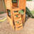 Treasure Cove Wooden Swing Set with Slides and Rock Wall