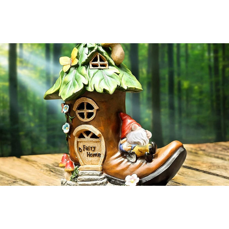 Statue de gnome Ericanthony reposant sur une maison de démarrage
