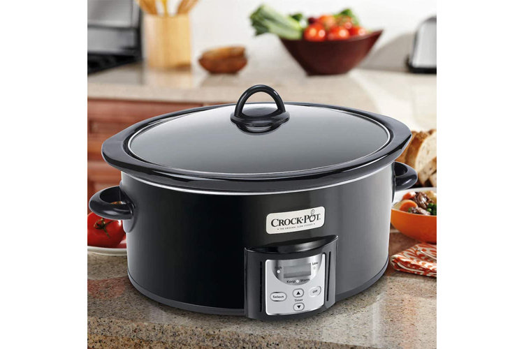 black slow cooker on kitchen counter