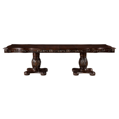 Table de salle à manger élégante avec rallonges en finition cerisier, accents dorés, piédestal double, sièges pour 8 cerisiers classiques, détails, base piédestal, peut accueillir une personne