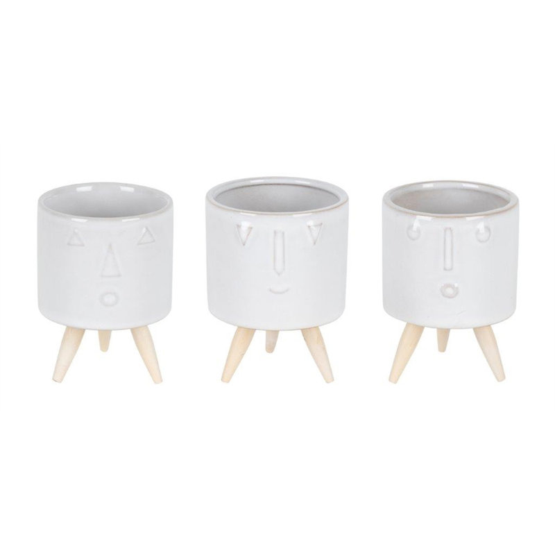 Ensemble de trois pots à fleurs en porcelaine blanche