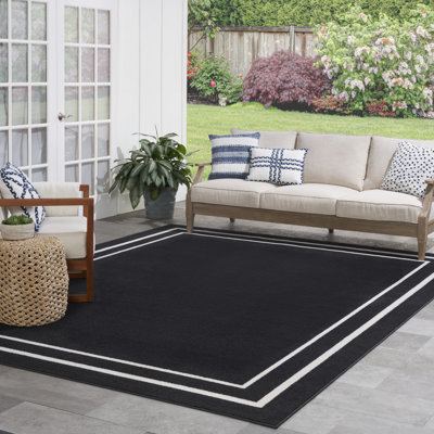 Aubreanna Abstract Machine Woven Chenille Indoor/Outdoor Area Rug in Black