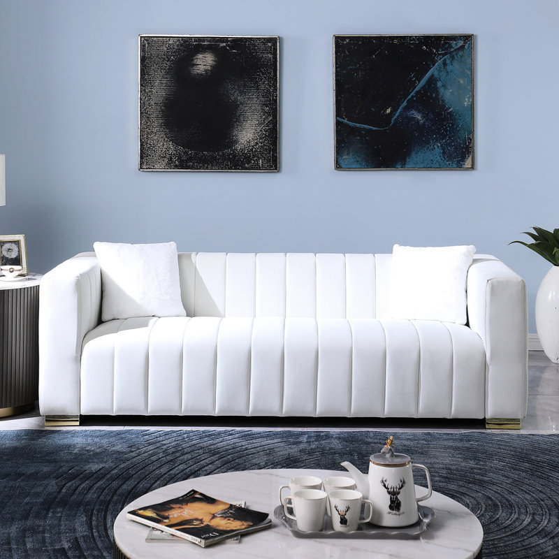 Élégant canapé en velours blanc avec coussins en mousse relaxants modernes