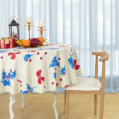 Nappe ronde de Noël en vinyle imperméable avec envers en flanelle, motif nœud et feuilles de houx.