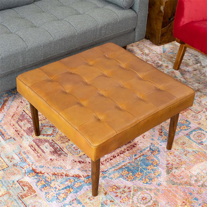 Repose-pieds polyvalent style Mid-Century avec design capitonné et pieds robustes