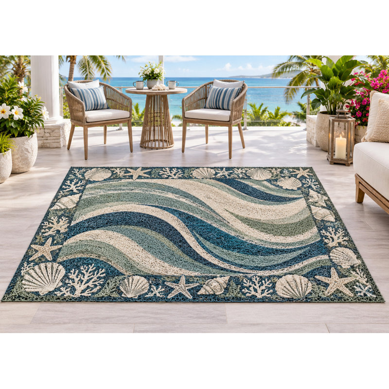 Tapis d'extérieur 152 x 213 cm, motif vagues et coquillages, en PVC épais, imperméable et bouclé, idéal pour une terrasse ou une entrée. Séchage rapide.