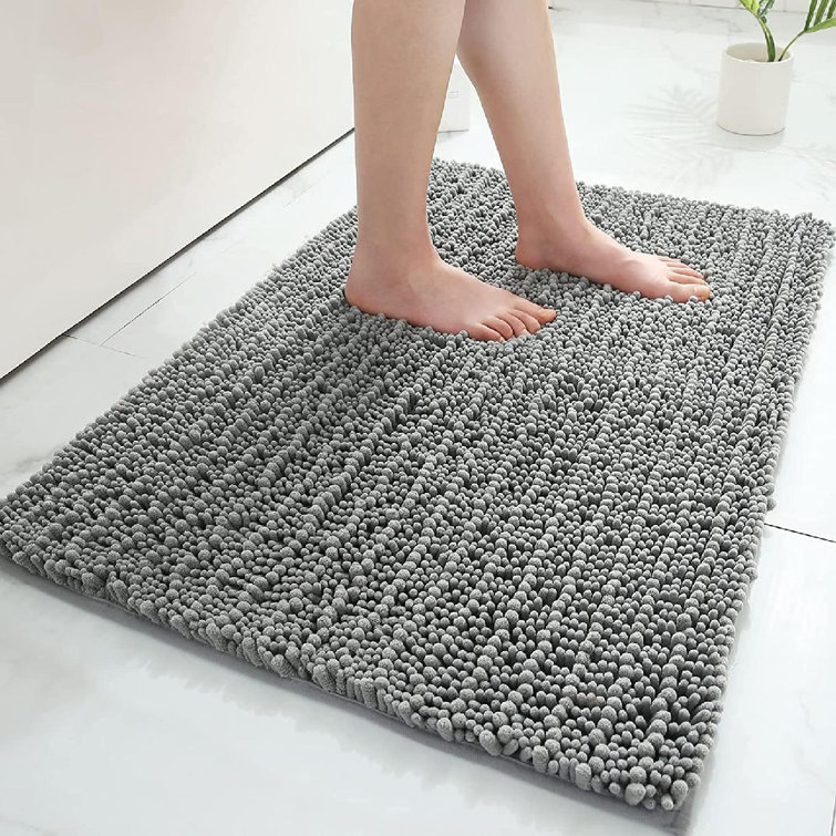 https://assets.wfcdn.com/im/63336784/resize-h755-w755%5Ecompr-r85/2185/218522344/Zavin+Non-Slip+Absorbent+Shaggy+Bath+Rug.jpg