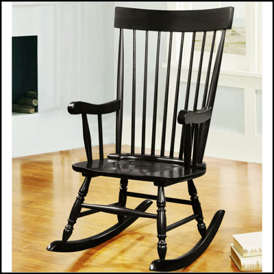 Chaise berçante noire à dossier fuselé avec chaises berçantes arrondies, combinant élégance classique et confort moderne pour toute maison