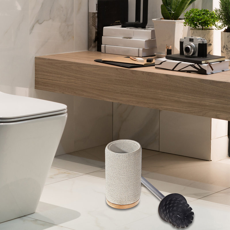 Porte-brosse de toilette en polyrésine avec base en bambou.