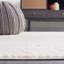 Tapis ivoire / beige en polyester tissé à la machine Bahiya-107529481
