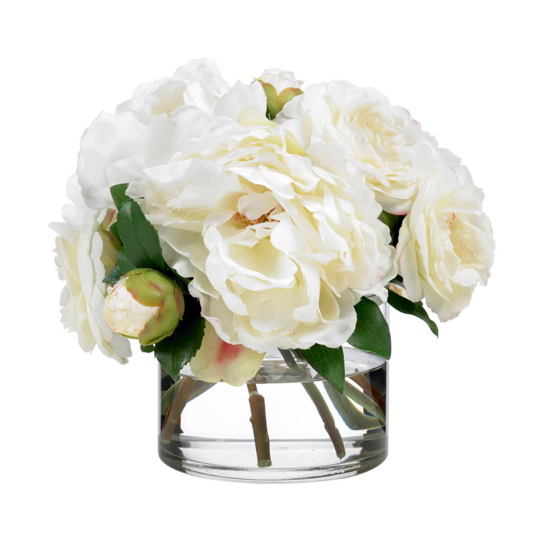 Bouquet de camélias et de pivoines attachés à la main