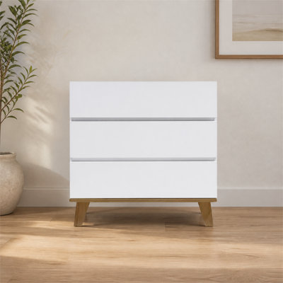 Commode blanche moderne à 3 tiroirs, structure sans poignée avec pieds en bois naturel massif, armoire de rangement polyvalente pour la chambre à coucher et le salon, installation simple