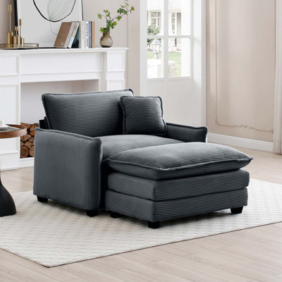 Canapé simple à assise profonde avec repose-pieds et coussin