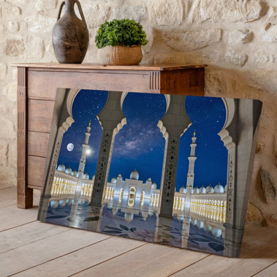 Canvas A Majestic Mosque Viewed Through An Ornate Archway At Night Wall Art Illuminated By A Bright Full Moon And Twinkling Stars In Canvas Wall Art