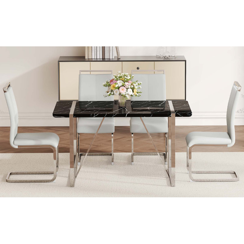 Ensemble de table et de chaises.Une table de salle à manger rectangulaire en MDF rustique industriel avec bureau en MDF et pieds en métal argenté électrolytique, avec 4 chaises avec coussin en polyuréthane et pieds en métal.