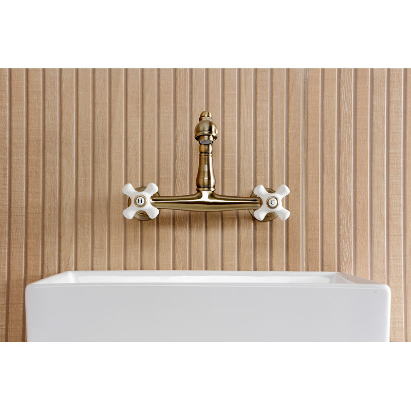 Kingston Brass English Country Two-Handle 2-Hole Wall Mount Bathroom Faucet, Antique Brass