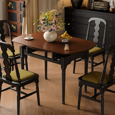 Table de salle à manger brune et noire en bois massif