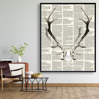 "Cornes de cerf sur un journal" sur toile