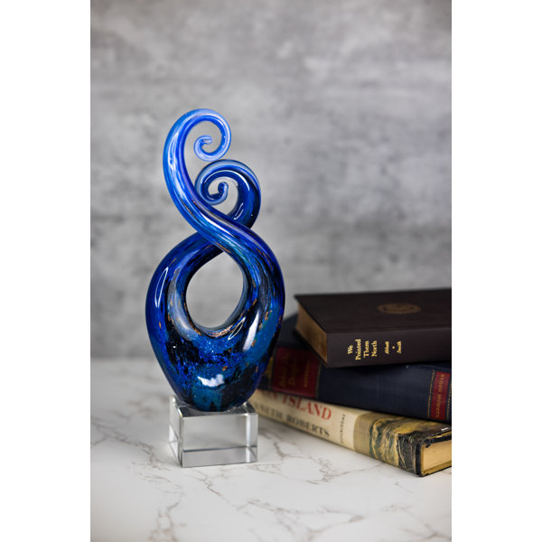 https://assets.wfcdn.com/im/63449009/resize-h600-w600%5Ecompr-r85/1694/169431565/Virna+Murano+Swirl+Centerpiece+Sculpture.jpg