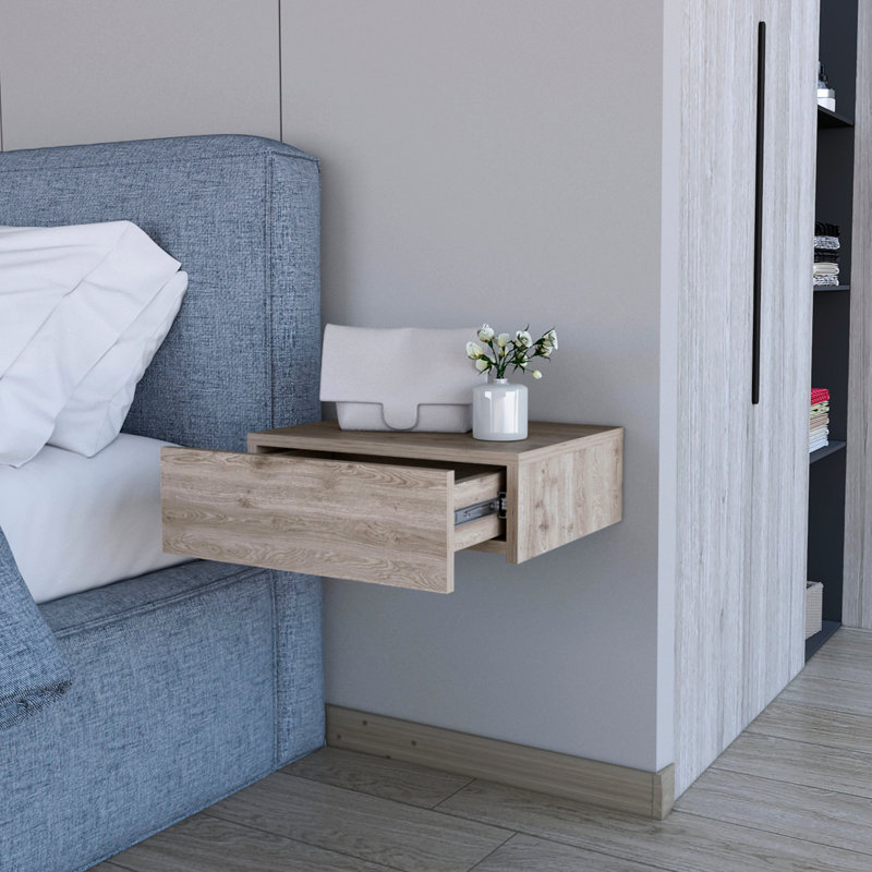 Table de chevet grise avec tiroir pour une chambre à coucher élégante et moderne dans un espace de rangement spacieux
