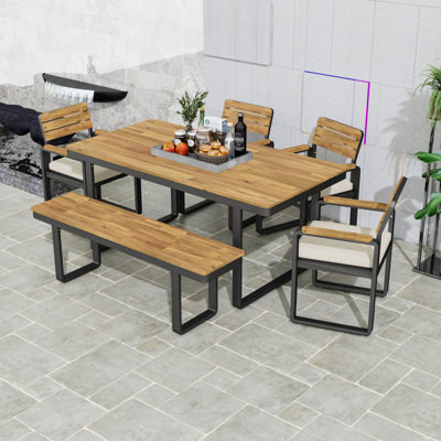 Ensemble repas 6 pièces avec table en bois d'acacia, chaises rembourrées et banc pour les rassemblements extérieurs