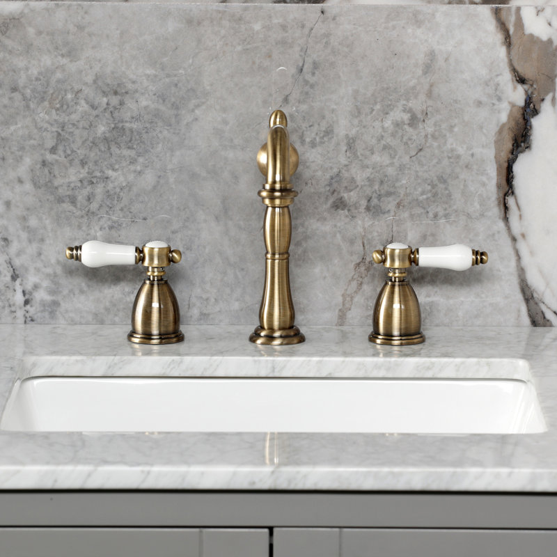 Kingston Brass Bel-Air Two-Handle 3-Hole Deck Mount Widespread Bathroom Faucet with Pop-Up Drain, Antique Brass