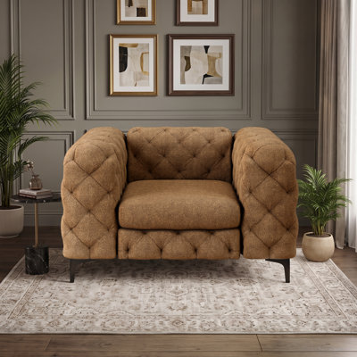 Fauteuil Chesterfield capitonné et rembourré en polyester