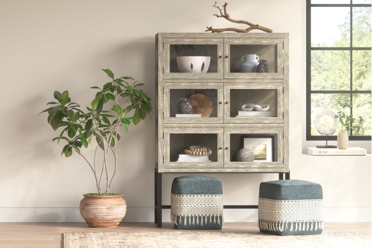 Rustic cabinet with sculptures decorating the shelves