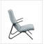 Fauteuil capitonné en tissu bleu clair