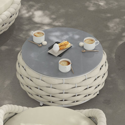 Table basse ronde d'extérieur avec plateau en marbre fritté à motif marbré