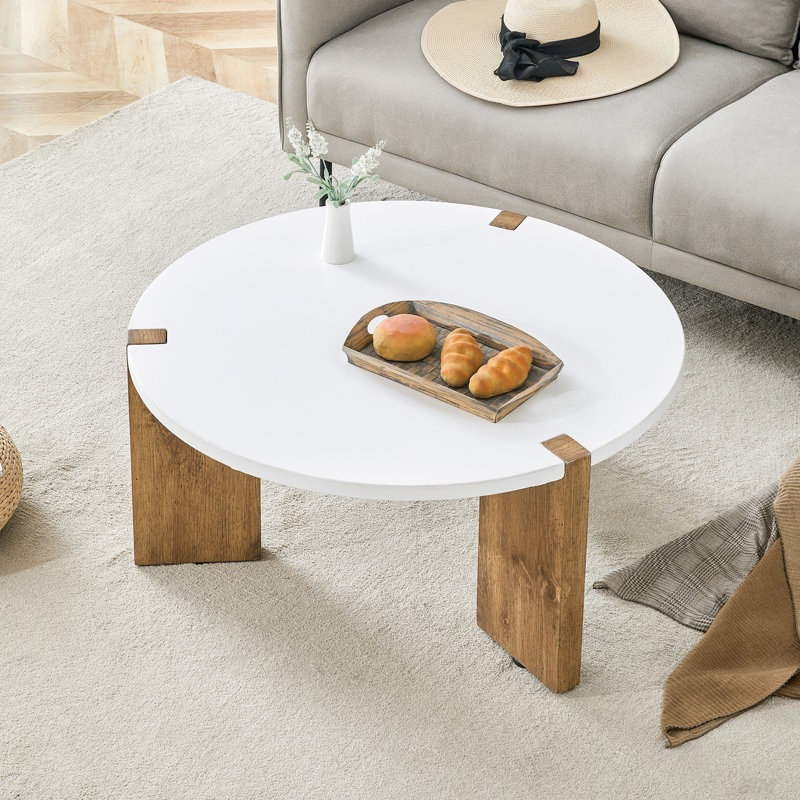 Table basse 33,4 pouces de diamètre minimaliste en panneau de fibres à densité moyenne, un choix stable et pratique. La conception unique encastrée et le support de trois pieds de table rendent la structure de la table basse stable.