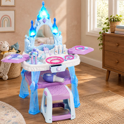 A pretend-play princess makeup vanity with a table and chair, light-up musical mirror and realistic toy hair dryer offers dress-up activities for girls ages 3+, including 3-, 4- and 5-year-olds.