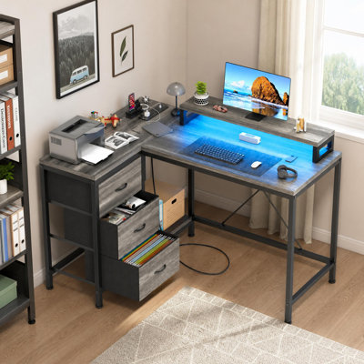 Bureau d'ordinateur de coin à 3 tiroirs en L pour bureau de jeu à DEL avec prises de courant et support pour bureau personnel
