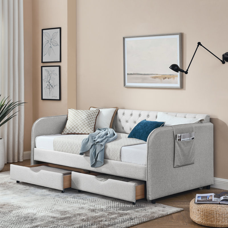 Lit de jour rembourré avec lit gigogne et compartiments de rangement, élégant pour la chambre d'amis, caractéristiques simples en lin beige, confortable