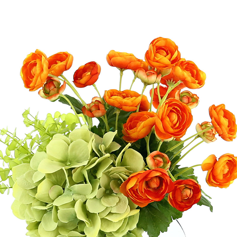 Ranunculus, Hydrangea and Eucalyptus Arranged in a Clear Glass Vase