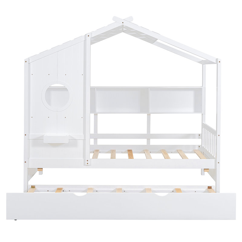 Lit simple blanc avec lit gigogne, conception moderne pour, construction en bois de pin, tablettes avec mini-livres, aire de jeu fantaisiste en bois avec toit, petite étagère de rangement et papeterie