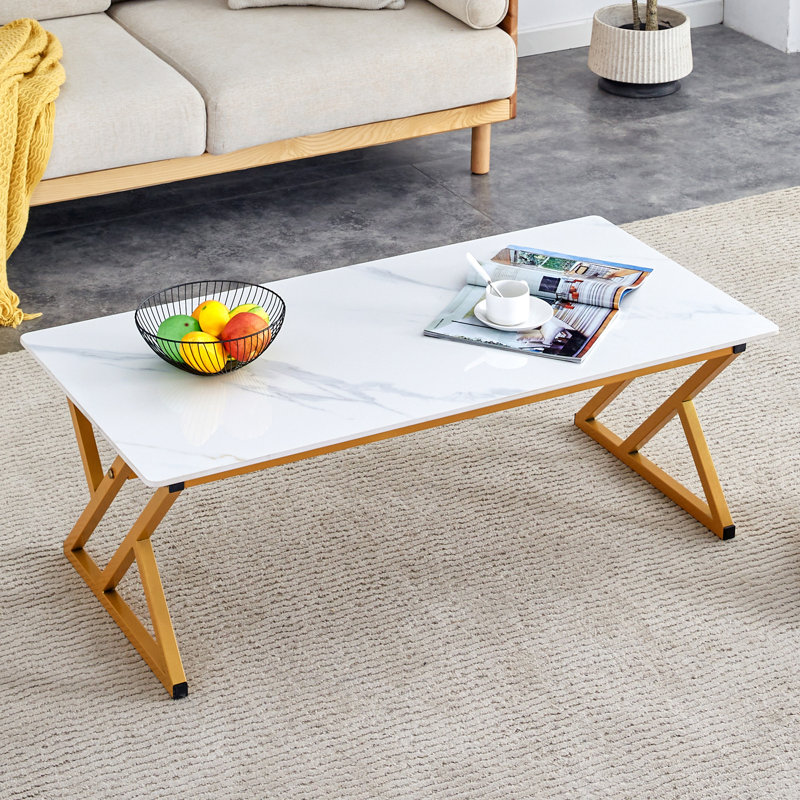 A Coffee Table Made Of Rock Slab Material, With A Smooth And Natural Surface That Complements The Modern Design Of The En Metal Legs, Making It Suitable For Living Rooms .47*23.6