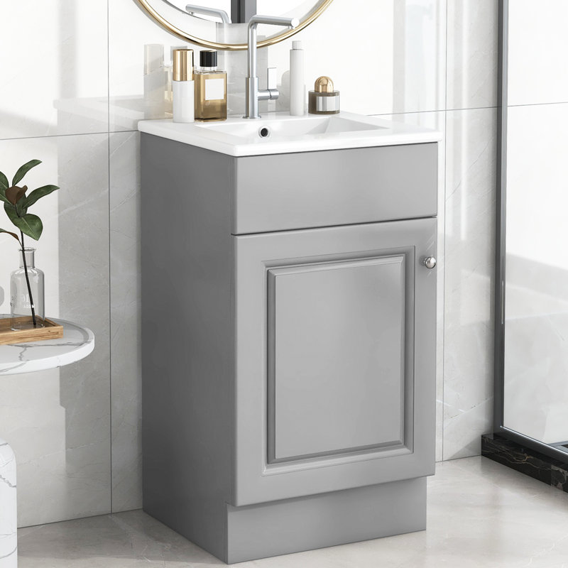 Meuble-lavabo de 18 po avec lavabo. Armoire blanche. Finition de la cuvette à la crasse. Tablette de porte et tablette réglable. Fabrication.