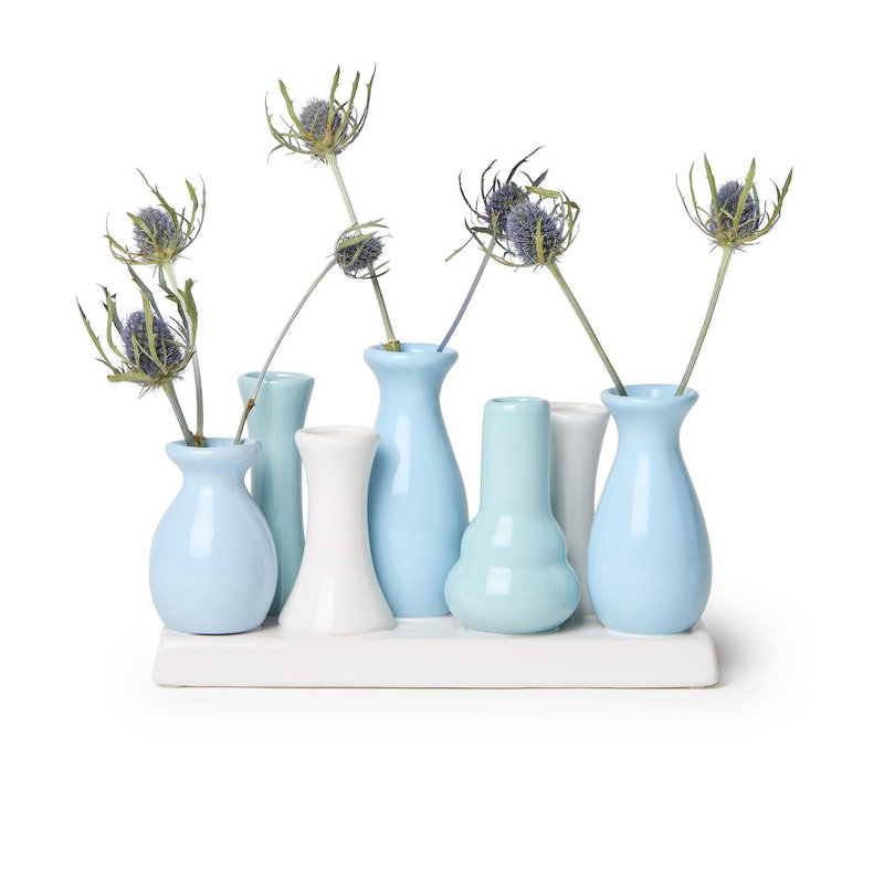 Vase bleu avec 7 sections sur la plateforme (les couleurs peuvent varier)