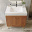 Meuble-lavabo sur pied de style Mid-Century avec dessus en faux marbre et lavabo en céramique-508256621