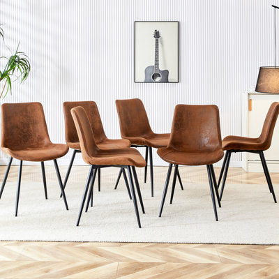 Charming Brown Suede Dining Chair With Black Metal Legs - Curved Widened Cushion For Optimal Comfort In Various Rooms Appealing Enhanced Seating Different Areas