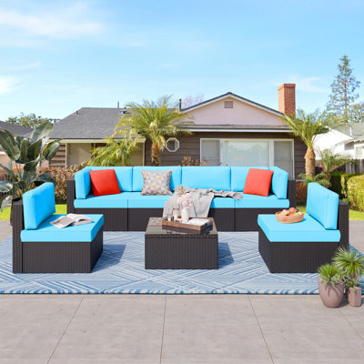  Arleht 7-Piece All-Weather Wicker Patio Set – Outdoor Sectional Sofa with Cushions, Pillows & Glass Coffee Table