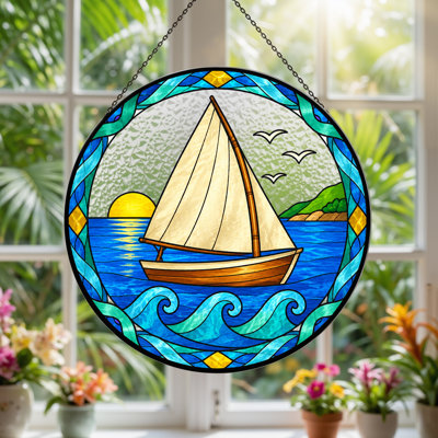 Voilier dans un cercle de vitraux avec toile coucher de soleil