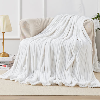 Flannel throw blanket with fringes