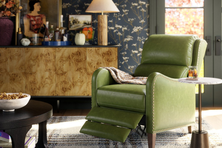 green faux leather recliner in an eclectic-style living room