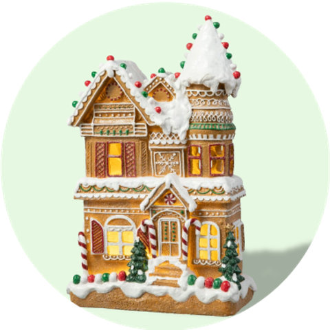 Gingerbread house with candy canes and Christmas trees.