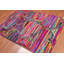 Tapis rose en coton touffeté fait main